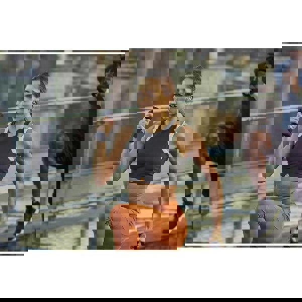 Man and woman performing resistance training holding Adidas 1kg Dumbbells