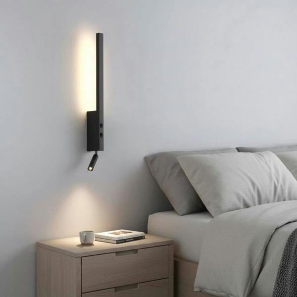 black bedside light with reading light installed in a modern bedroom next to the bed