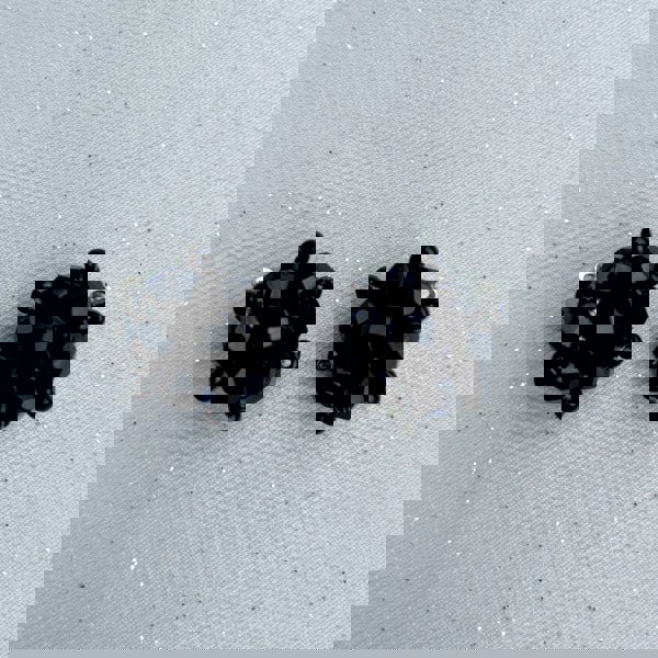 Black clip-on earrings, faceted black beads, clustered design, vintage inspired style, lightweight and comfortable, elegant statement jewellery
