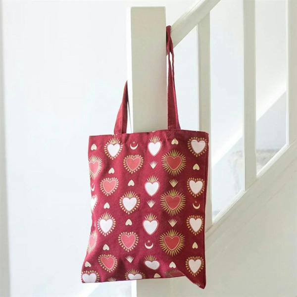 Sacred Heart print tote bag with red heart and moon pattern, fabric handles