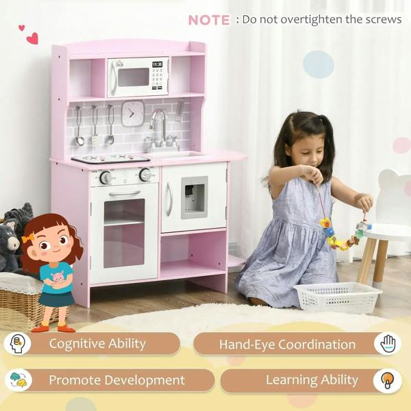 Pink kids kitchen playset with open oven, side cabinet, sink area, and cooktop controls