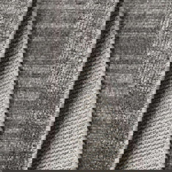 Close-up of Arlo Textured Rug showing soft grey tone, durable polyester fabric and refined edge detailing.