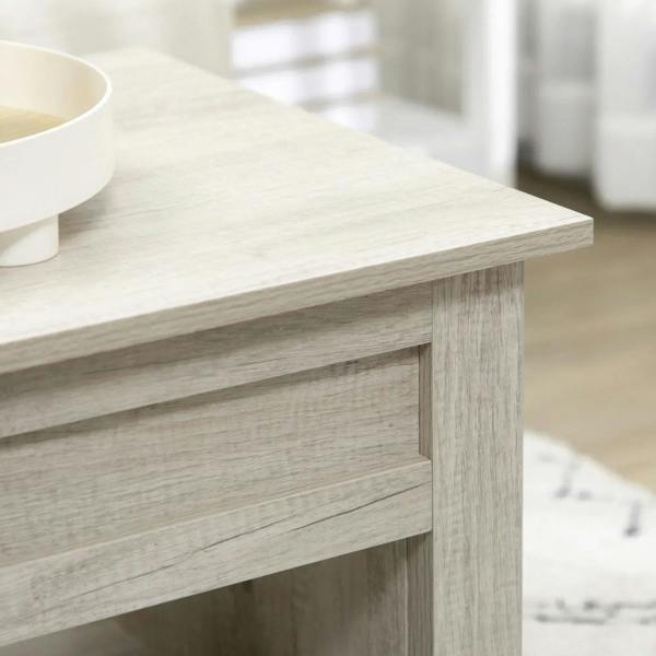 Light oak-effect lift-top coffee table corner and apron detail, sturdy frame