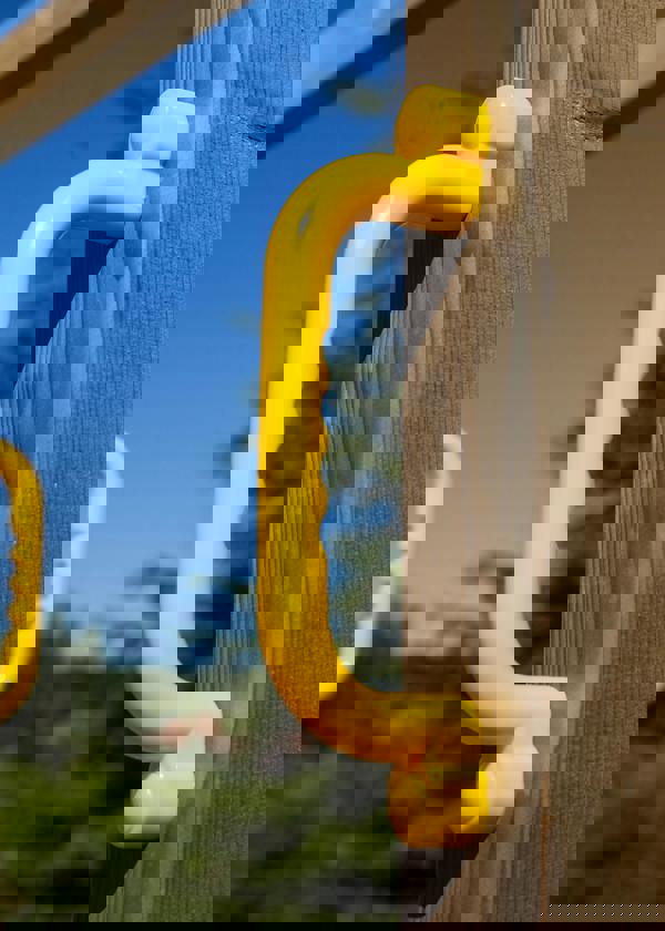 Climbing frame Rumble Ridge Rock Wall featuring single swing and slide - Best Shed