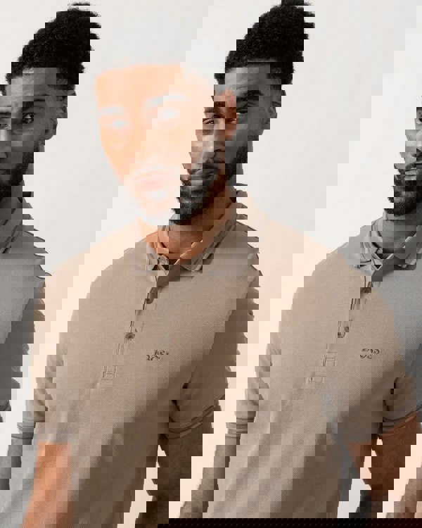 Model wearing BOSS Green Mens Paddy Cotton-Piqué Polo Shirt with Contrast Logo in Light/Pastel Green 339 - detail