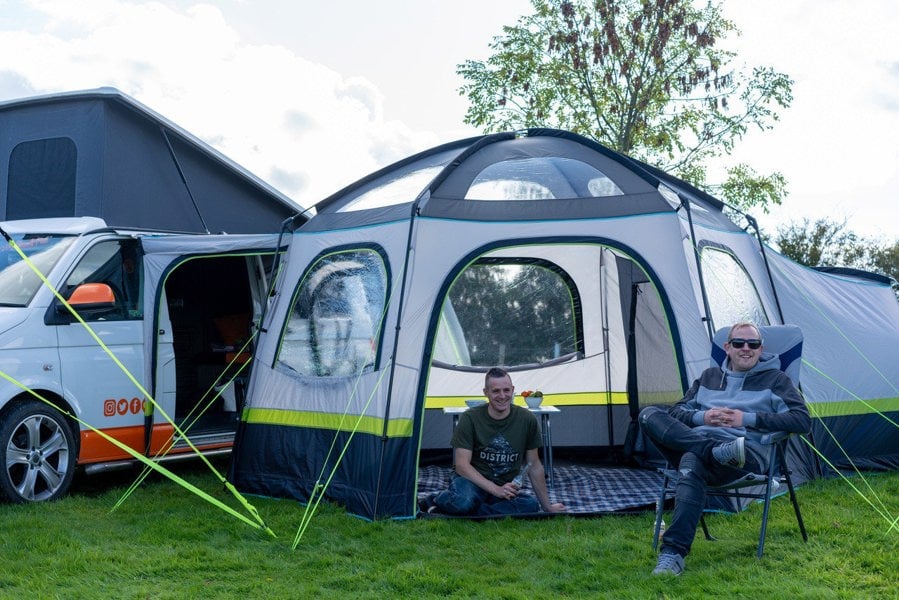 Two males outside of the Hive Campervan Awning Fibreglass Poles - with Sleeping Pod from OLPRO.