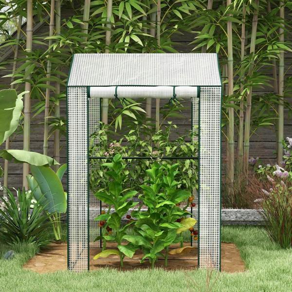 White mini greenhouse with open front roll-up doors and plants inside