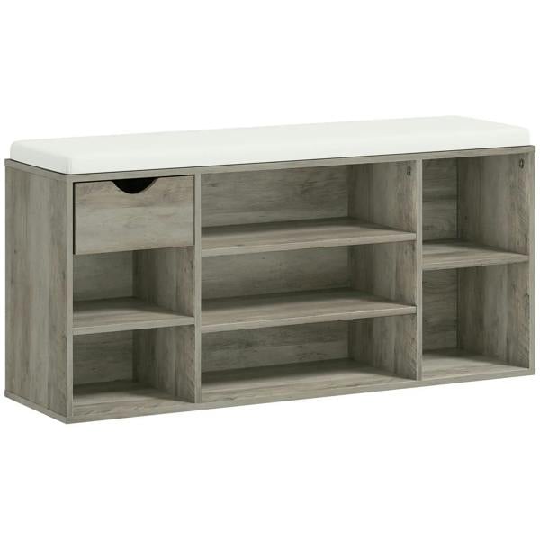 Grey shoe storage bench with cushioned top and open cubby compartments