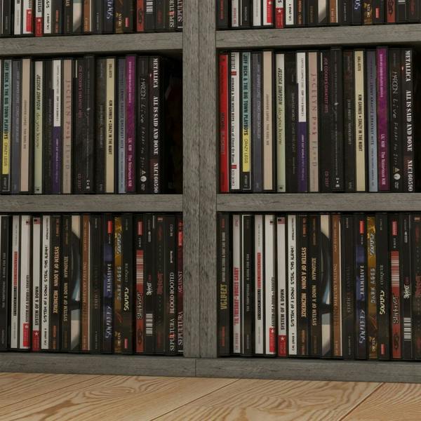 Close-up of CDs stored in dark wood-effect CD shelf compartments.