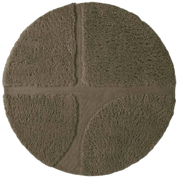 Round brown bath mat with textured surface on a white background