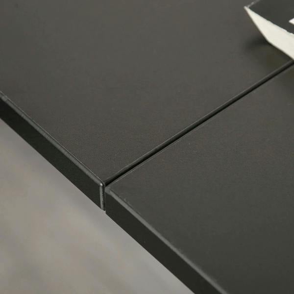 Black desk corner edge with metal frame detail