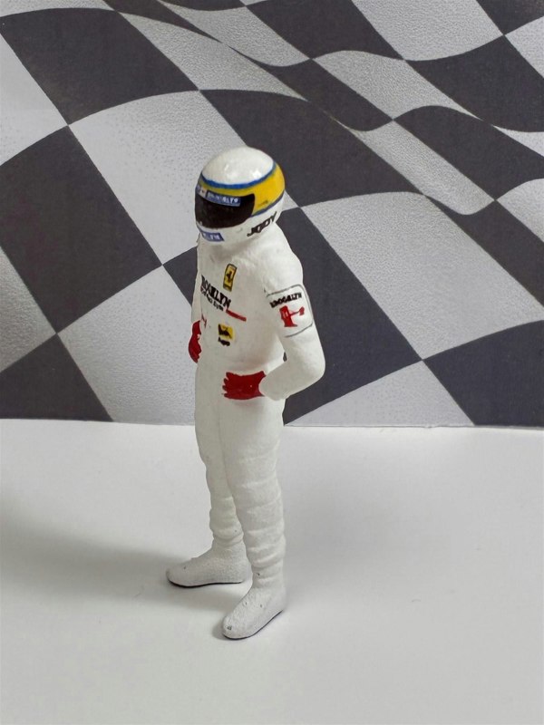 a toy figure of a man wearing a helmet