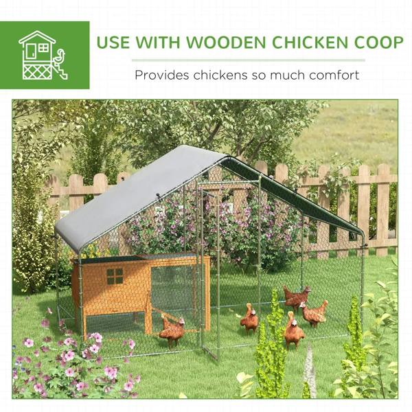 Galvanized chicken coop in a yard setting with weather cover on the roof