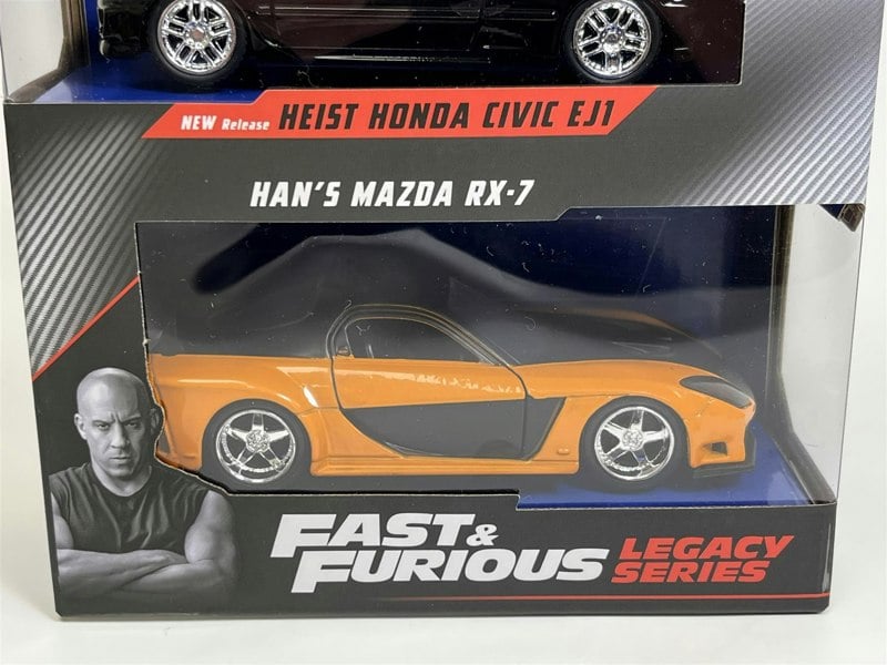a yellow and black toy cars in a box
