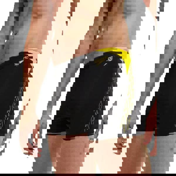 Black Speedo Hyperboom Splice Aquashort swim trunks with yellow accents