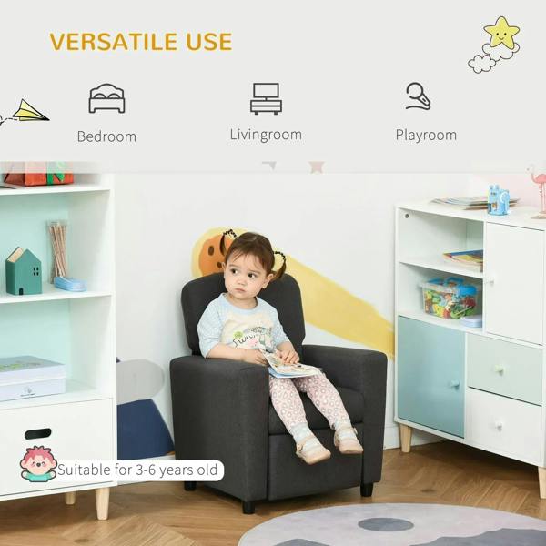 Grey kids armchair sofa with footrest, child seated in a playroom