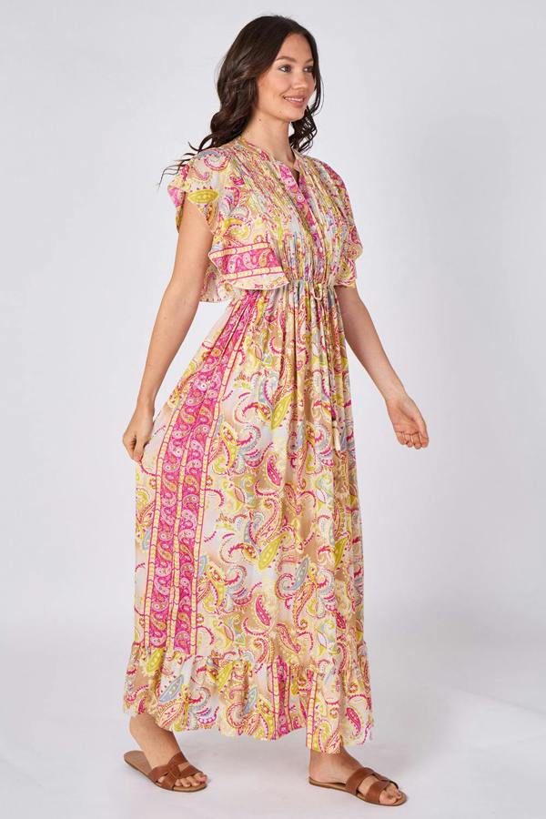 Woman wearing a colorful patterned dress on a white background