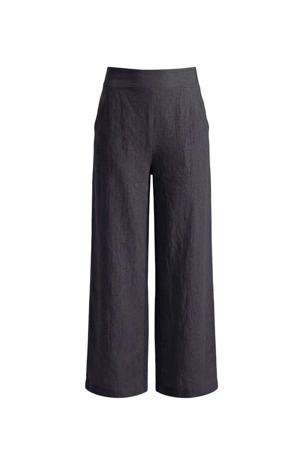 Invisible mannequin shot of the Relaxed Navy Linen Trousers by James Lakeland against a beige background