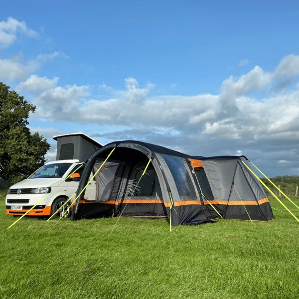 An image of the OLPRO Charcoal & Orange Cocoon Breeze Campervan Awning Extension attached to the Cocoon Breeze that has been fixed to a VW Campervan.