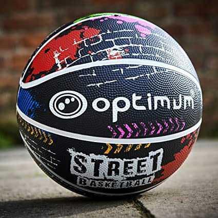 Black Street Basketball on tarmac against a brick wall, lifestyle shot - Optimum