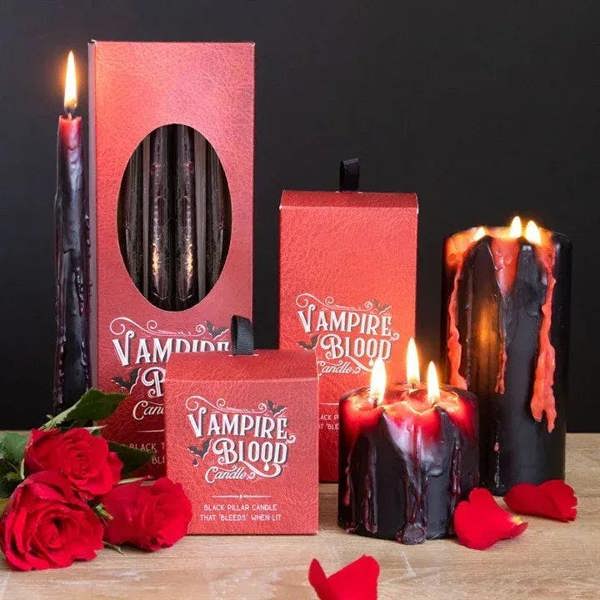 Vampire Blood candle set with red boxes, eight black tapers, roses, and flames