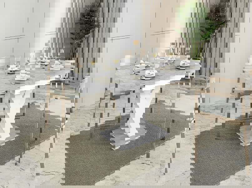 Extendable MASIV dinner table in concrete grey and plain white finish.