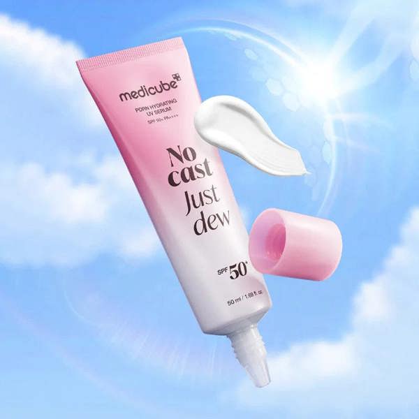 Lightweight, serum-like, and non-sticky chemical sunscreen by Medicube that leaves a radiant, dewy finish and layers perfectly under makeup at Atelier De Glow UK.