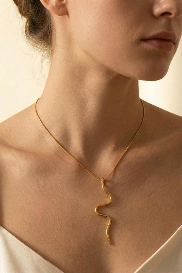 ARIIRA India Gold Tone Wavy Serpent Pendant