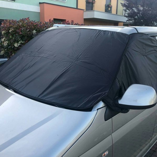 The External Blackout Screen For VW T5/T6 Campervans by OLPRO on a VW T5 in a carpark near a bush.