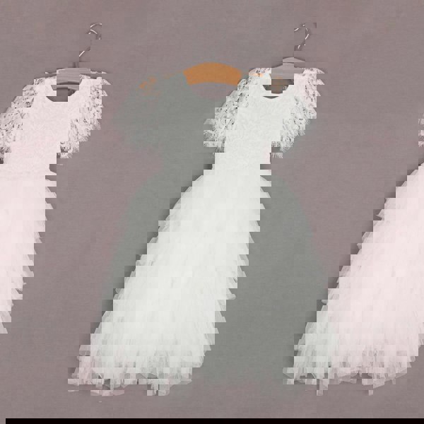 white pretty dress on hanger