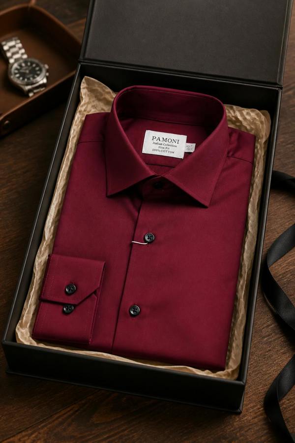 Red dress shirt in a black box with 'Pamoni' label, watch partially visible on wooden surface.
