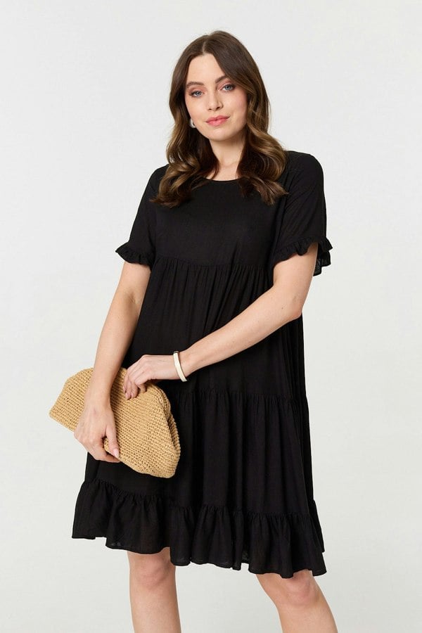 Black | Short Sleeve Frilled Short Smock Dress : Model is 5'9"/175 cm and wears UK8/EU36/US4/AUS8
