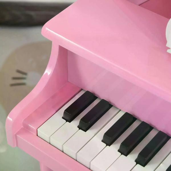 Pink mini kids piano keyboard with black and white keys
