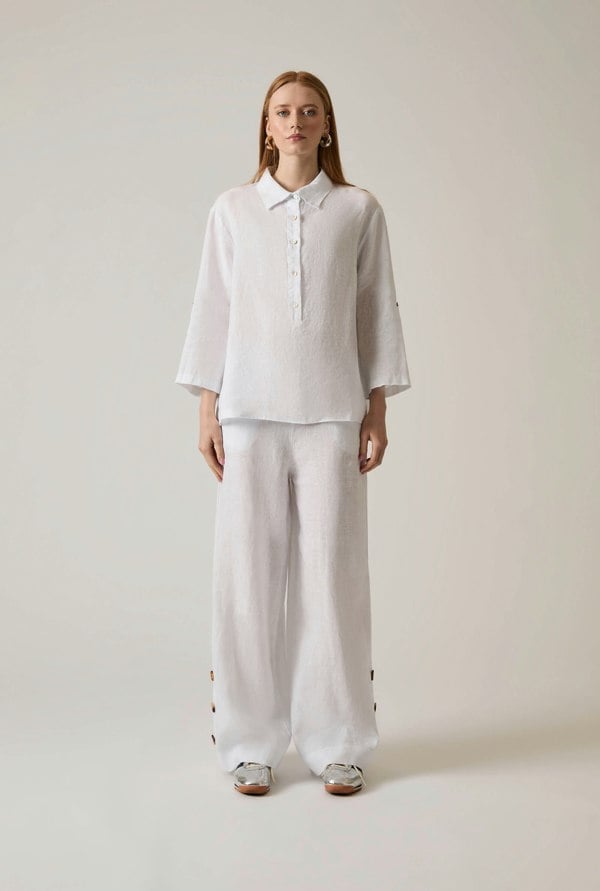 White linen blouse with button front and roll tabs
