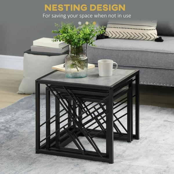 Black metal nesting coffee table with grey tabletop and cross-braced open sides