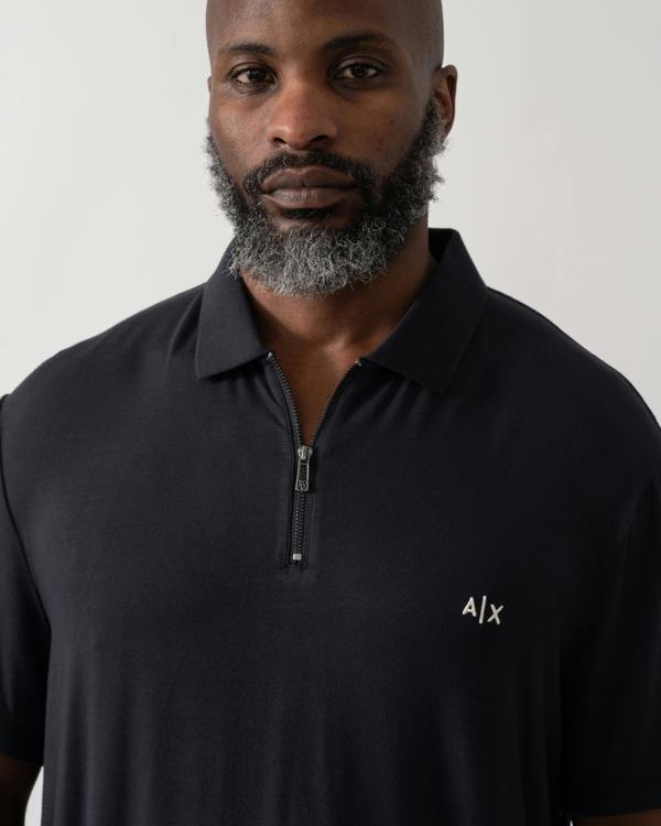 Detail of a Model wearing an Armani Exchange Mens Polo Shirt in Deep Navy