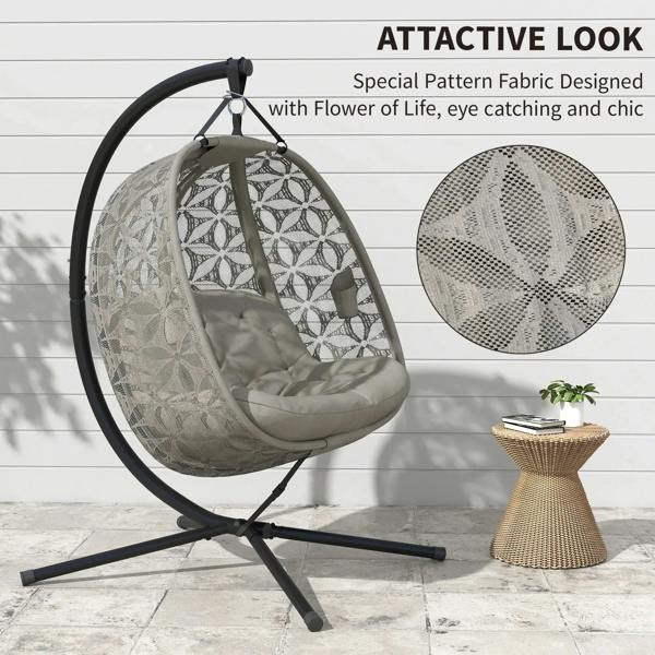 Outdoor hanging chair with leaf-pattern fabric seat, padded cushion, round hanging frame