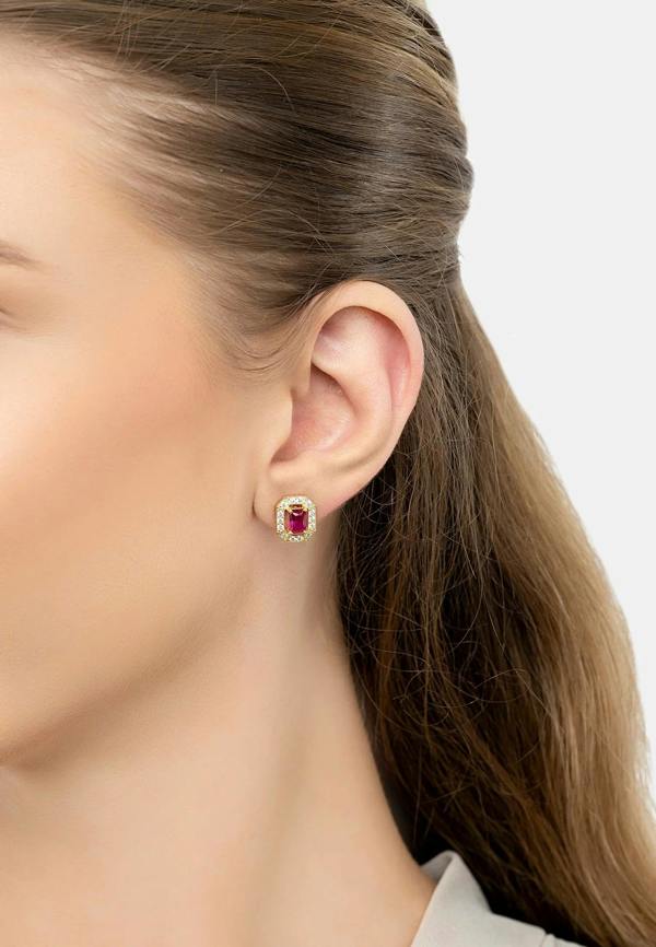 The earring worn by a model.