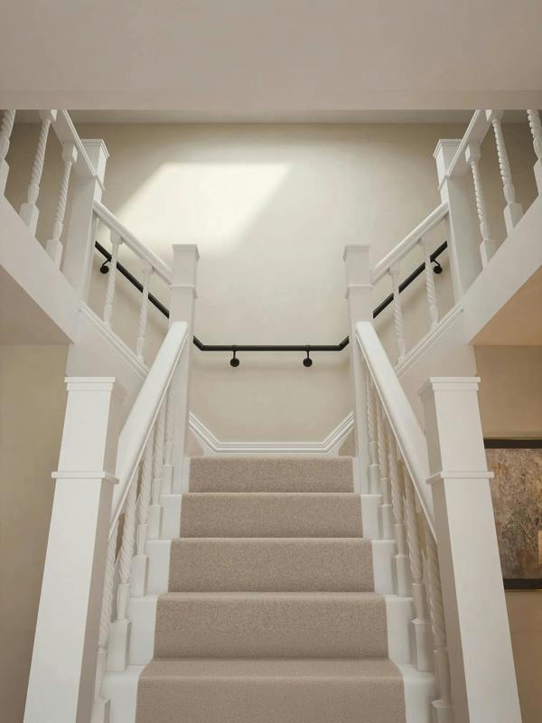 Kineton Matt Black wall-mounted handrail fitted on a T-shape staircase, front view – Handrails Direct UK supplier of modular indoor handrails and fittings