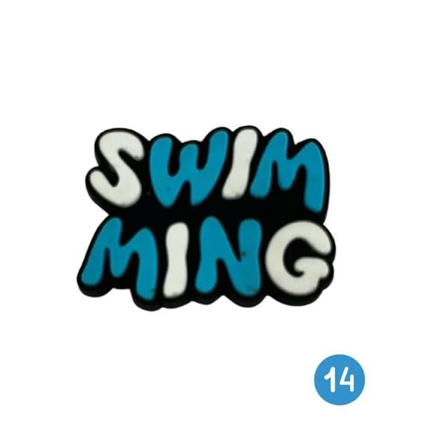 Blue and white swimming patch shoe charm on black background