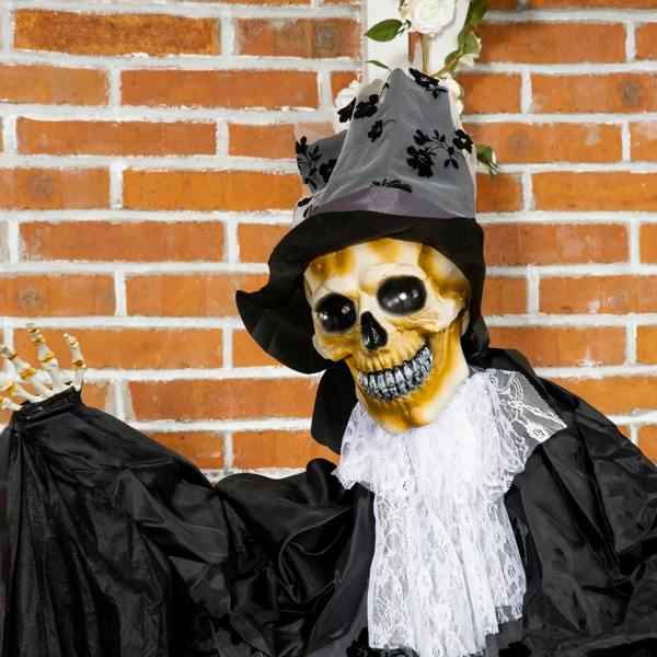 Black ghost bridegroom prop with skull face, gray top hat, and white lace ruffle collar