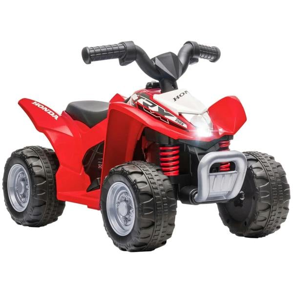 Red Honda kids electric quad bike with front headlight, black tread tires, and padded seat