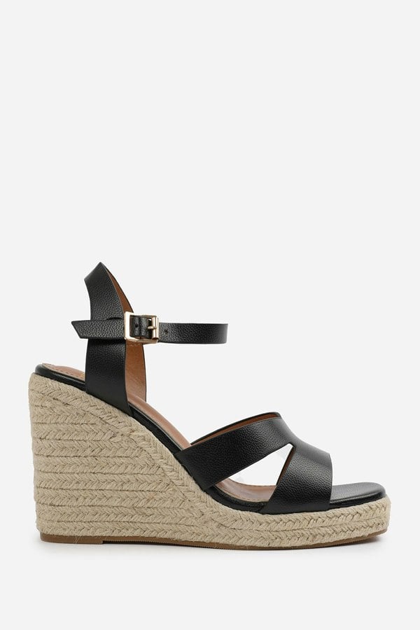 Where's That From Sansa Wide Fit Cut Out Strap Detail Wedge Shoes With Buckle Closure in Black Grain Pu