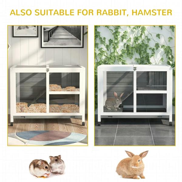 Grey wooden rabbit hutch with open doors and two compartments, with a rabbit inside
