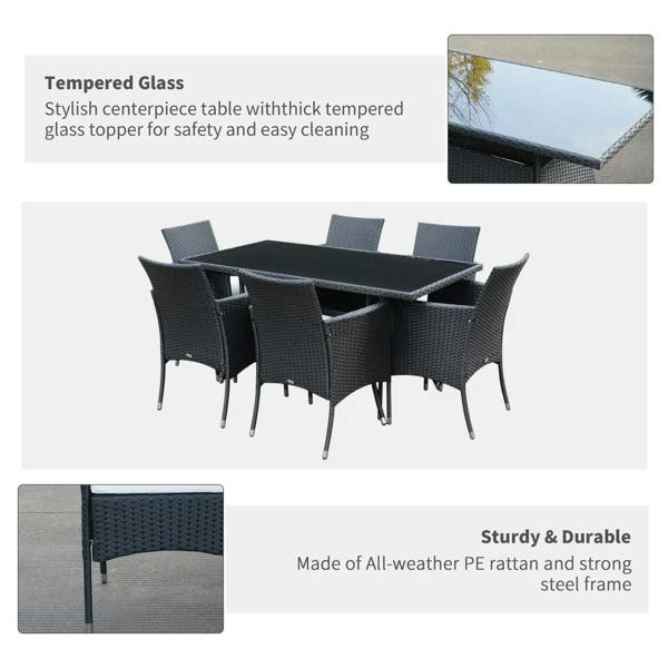 Black rattan dining set with 6 armchairs, cushioned seats, and glass tabletop