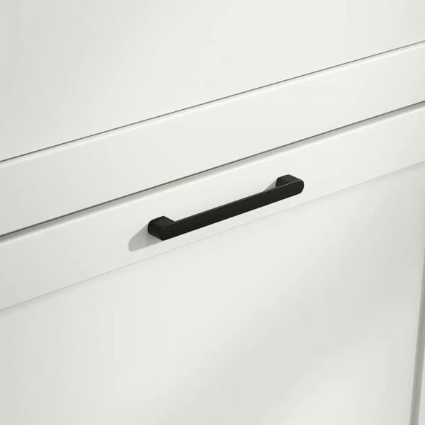 Black handle on white flip drawer front of a shoe cabinet