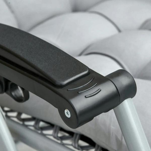 Light grey and black armrest end cap on a reclining lounge chair frame