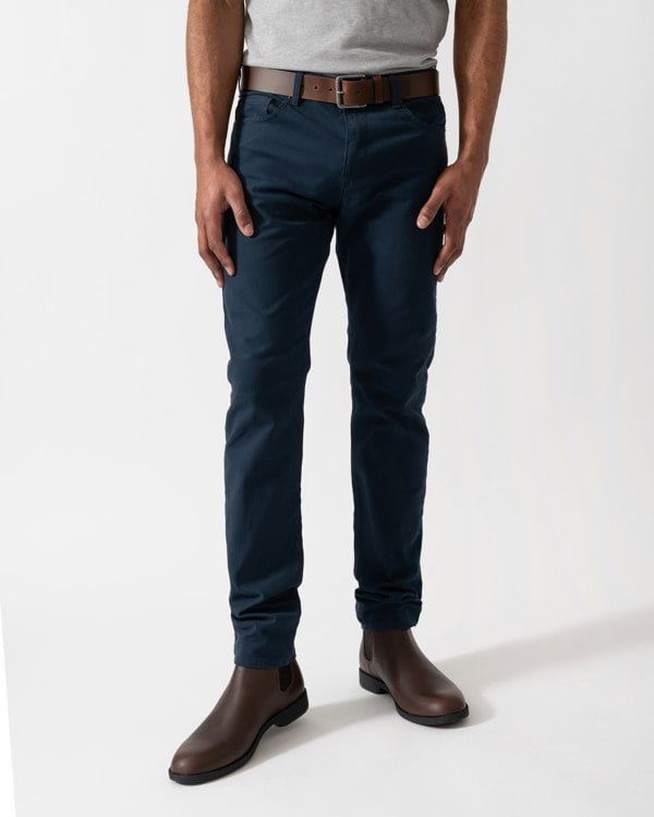 Model wearing a pair of BOSS Orange Delaware Mens Jeans in Open Blue