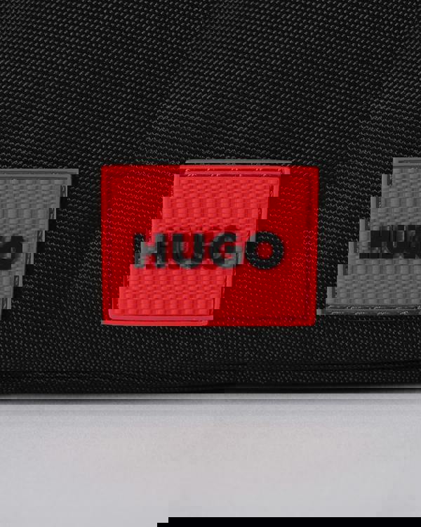 logo detail of a HUGO Ethon 3.0 Mens Crossbody Bag in Black