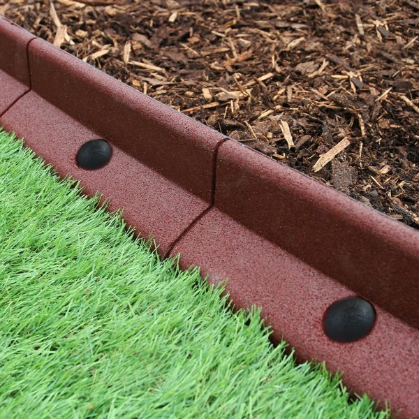 Flexible terracotta lawn edging, 1.2m x 6, featuring a textured surface, curved shape, and black connectors, ideal for garden borders